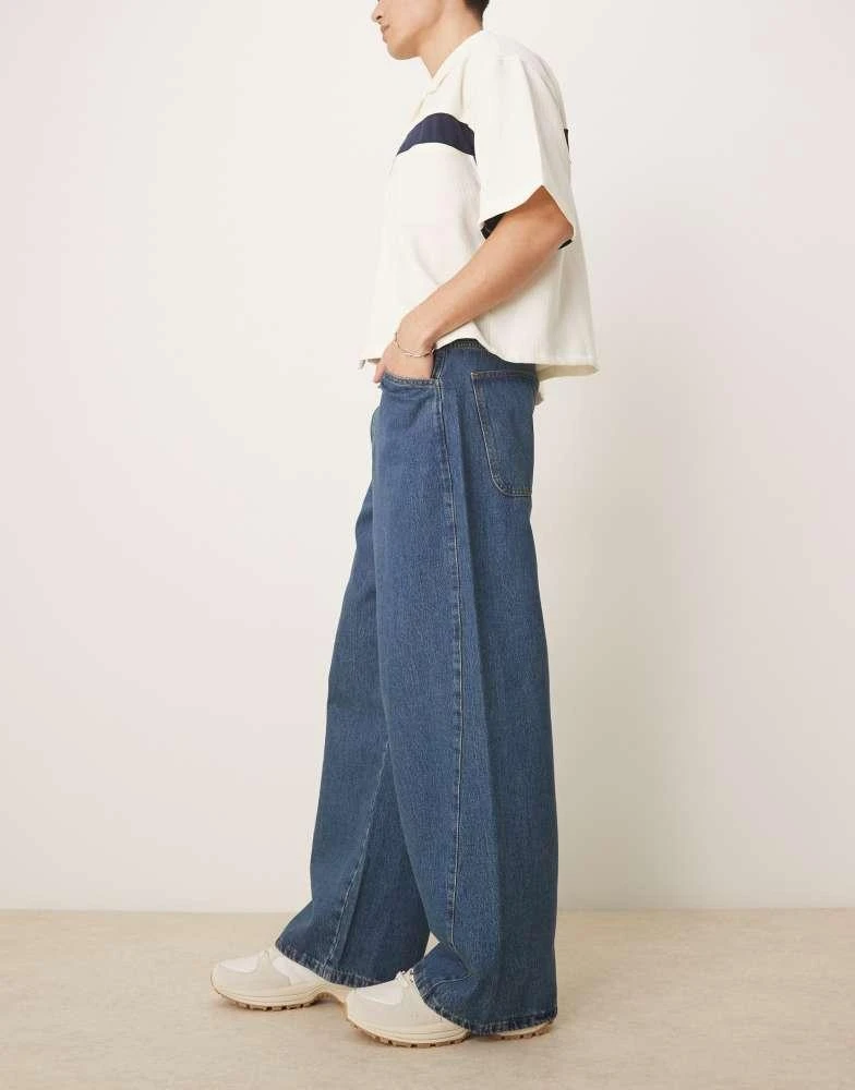 ASOS ASOS DESIGN super baggy jeans with twisted seams in mid wash blue 3