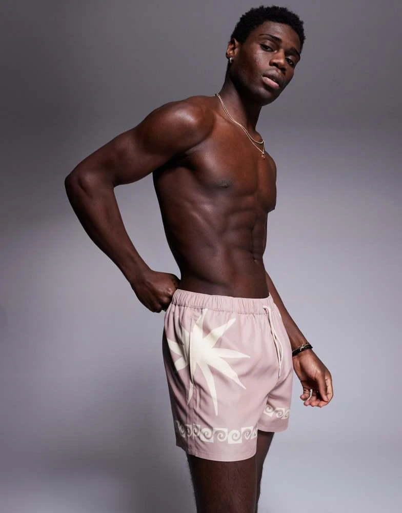 ASOS ASOS DESIGN swim shorts in short length with sun print in pink 1