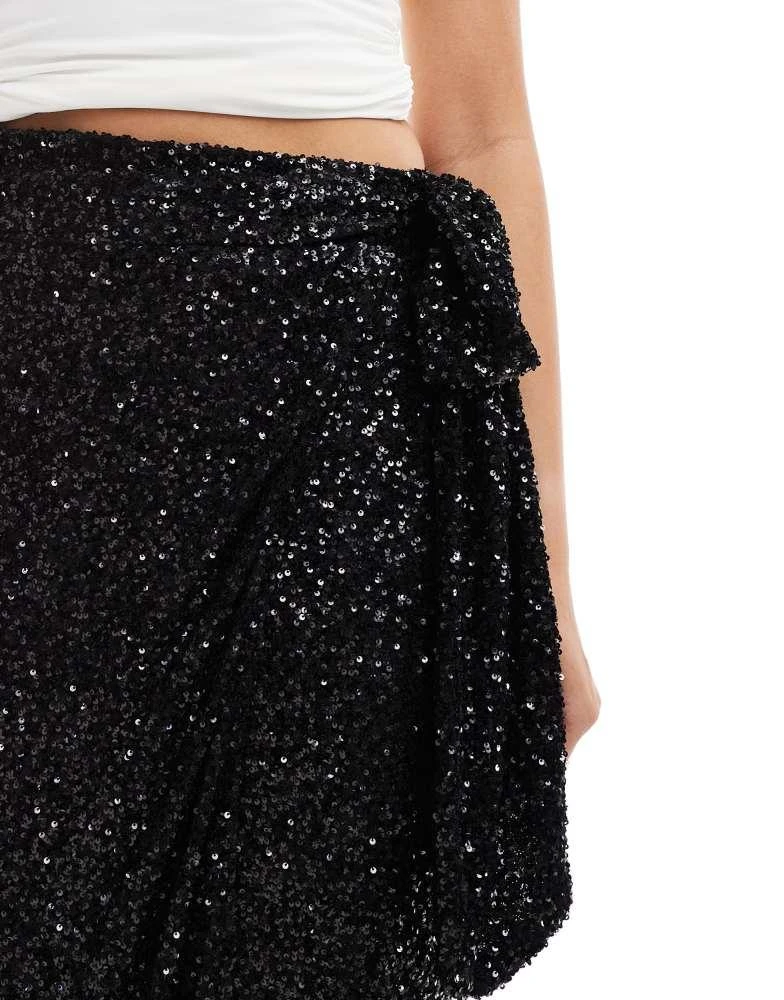 Never Fully Dressed Jaspre sequin wrap maxi skirt in black  On Sale Now  with Up to 39% Off | Discover Exclusive Deals & Savings at BeyondStyle   Authentic Never Fully Dressed