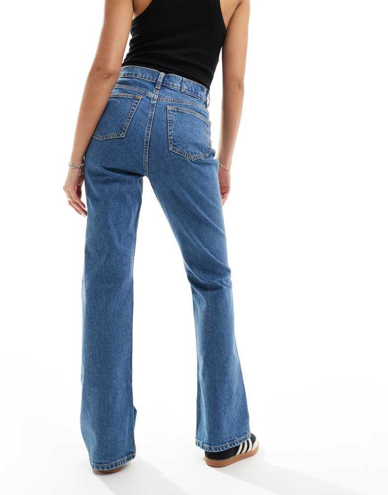 ASOS ASOS DESIGN mid rise flare jeans in mid blue