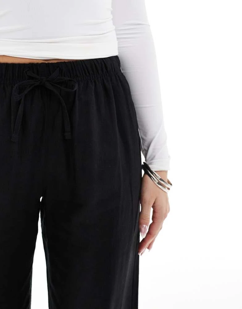 Bershka Bershka tie waist wide leg linen trousers in black 4