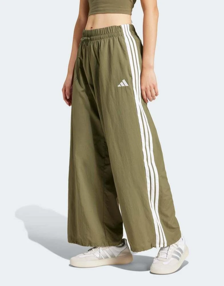 Adidas adidas Performance essentials 3-stripes lifestyle woven parachute pants in green 1