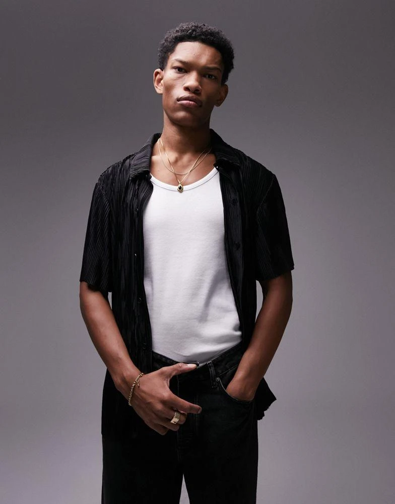 Topman Topman oversized fit button through polo with jacquard plisse in black 1