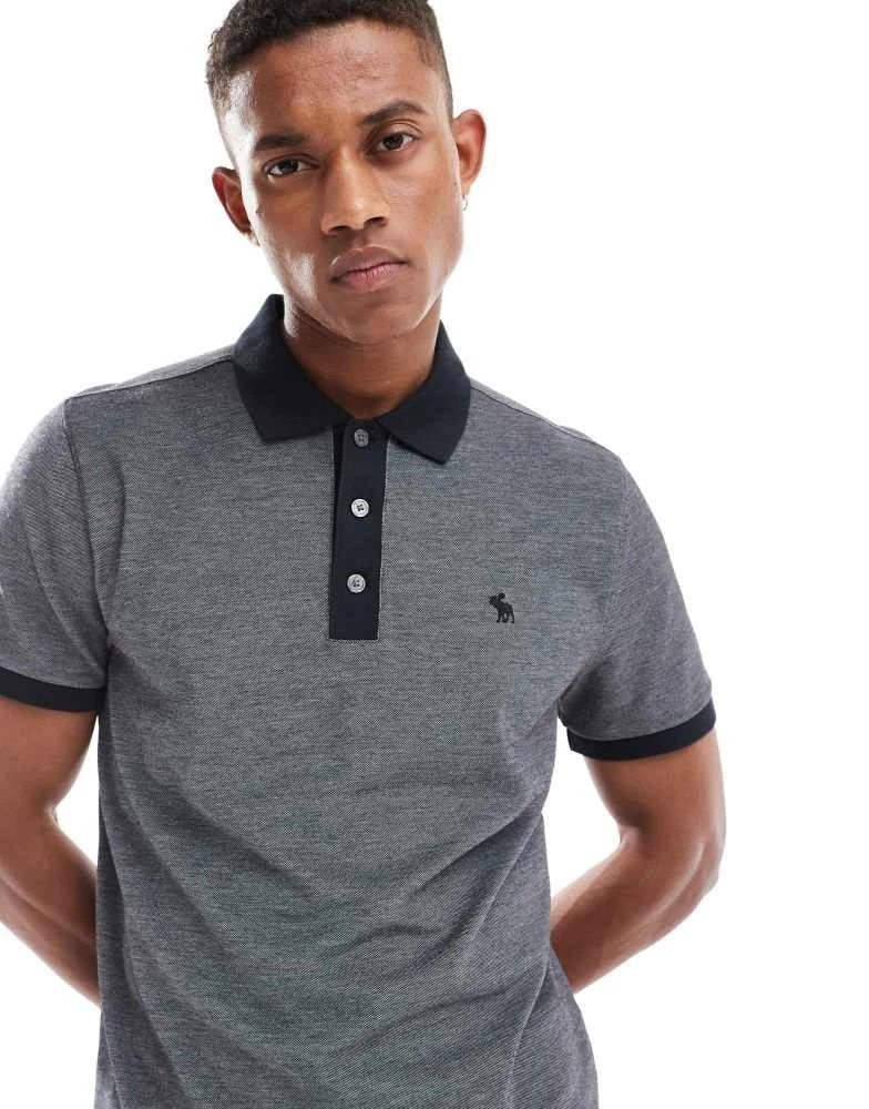 Abercrombie & Fitch Abercrombie & Fitch chic icon logo texture polo in black 1