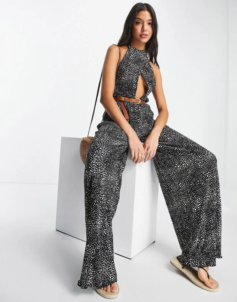 ASOS ASOS DESIGN plisse halter cut out jumpsuit with belt in spot print 3