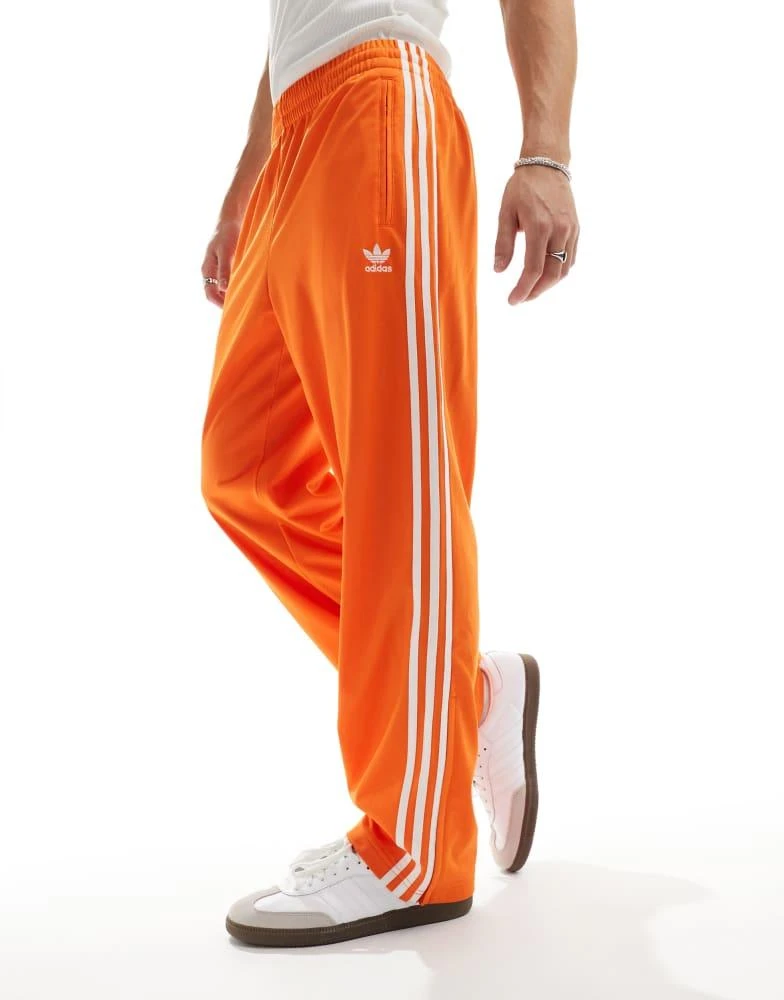 adidas Originals adidas Originals Firebird track pants in orange 5