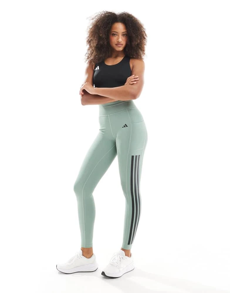 Shop adidas Training Optime stripe full length leggings in