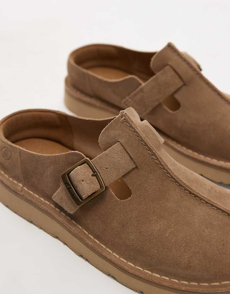 Shop Clarks Solsbury mule in cola brown suede on Sale at