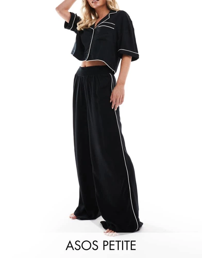 ASOS ASOS DESIGN Petite super soft slinky wide leg pyjama trouser in black with contrast binding 1