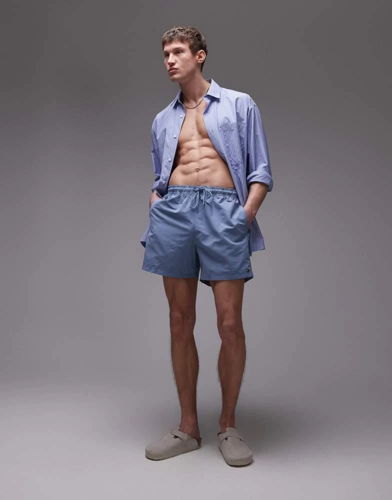 Tommy Hilfiger Tommy Hilfiger drawstring flag taping swim shorts in blue 4