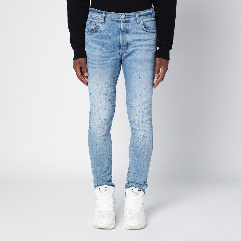 AMIRI LIGHT BLUE WASHED SKINNY JEANS WITH WEAR