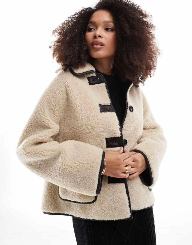 Stradivarius Stradivarius reversible borg jacket in ercu and brown 1