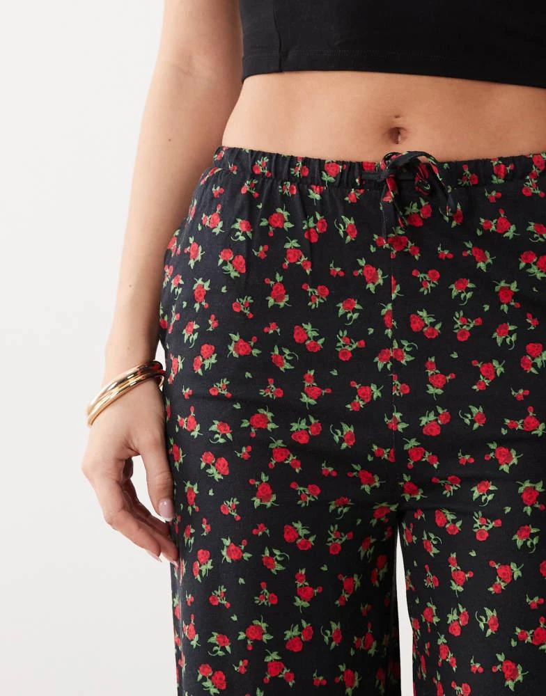Threadbare Threadbare jersey pull on trouser with drawstring in black with red floral print 3
