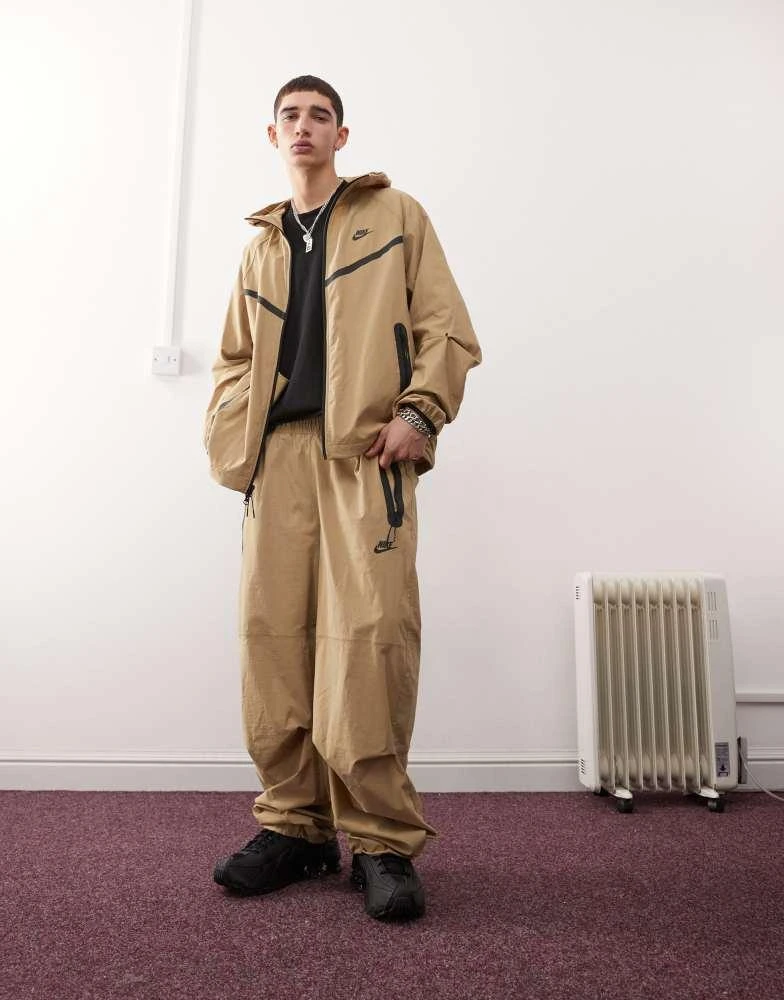 NIKE Nike Tech woven trouser in beige 1
