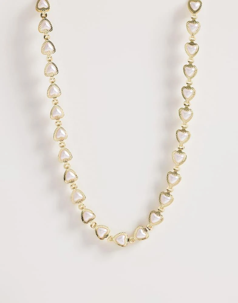 ASOS ASOS DESIGN Curve short necklace with mini hearts with faux pearls in gold tone