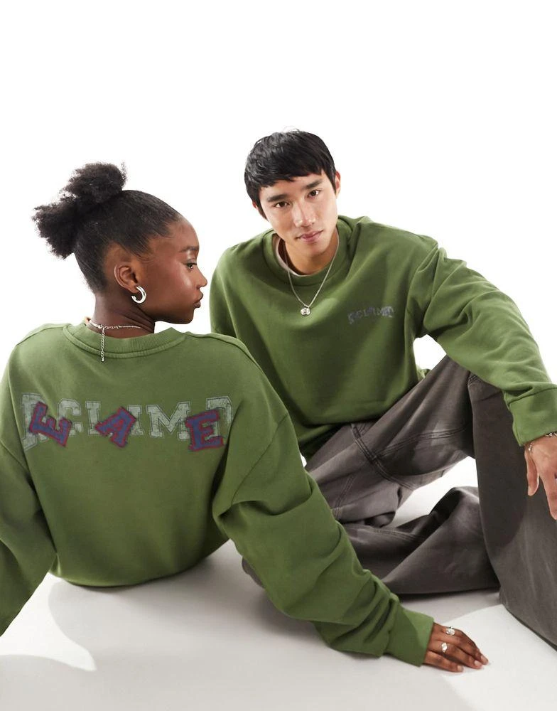 Reclaimed Vintage Reclaimed Vintage unisex oversized sweat with sports varsity logo in khaki 1