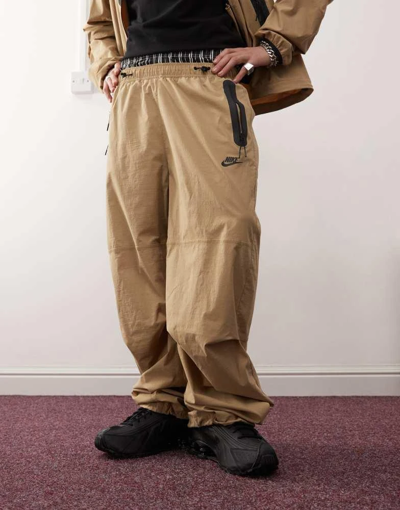 NIKE Nike Tech woven trouser in beige 5