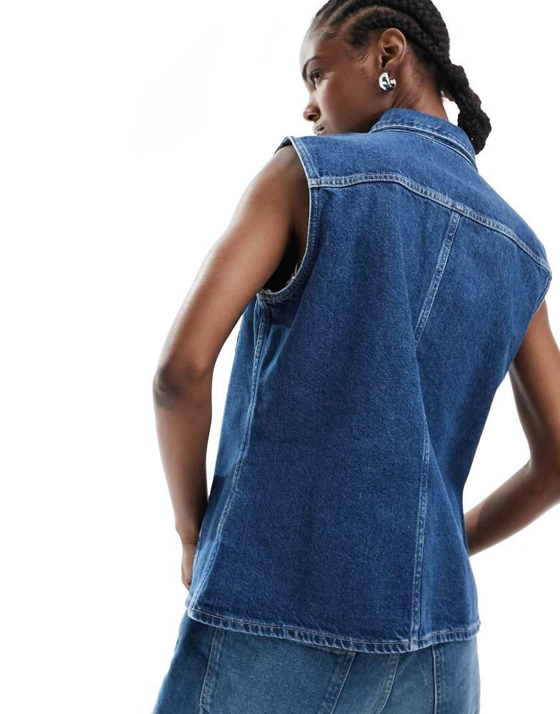 Calvin Klein Calvin Klein Jeans sleeveless lean denim shirt in mid wash 4