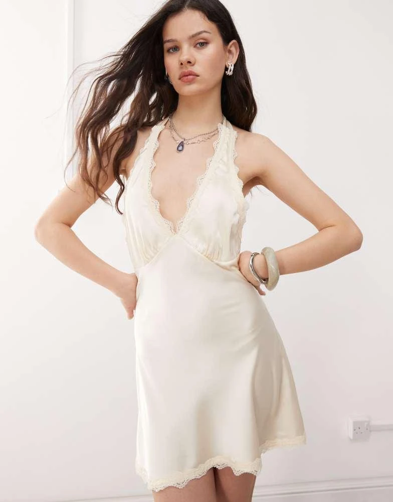 Shop Lioness Stars Align satin lace trim halterneck plunge mini slip dress  in cream on Sale at BeyondStyle  Get 11% Off Lioness Stars Align satin lace  trim halterneck plunge mini slip