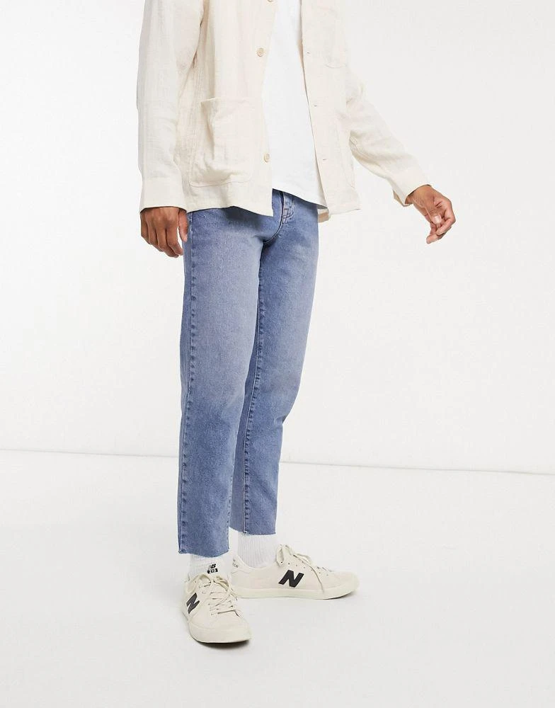 ASOS ASOS DESIGN classic rigid jeans in vintage light wash blue with raw hem 4