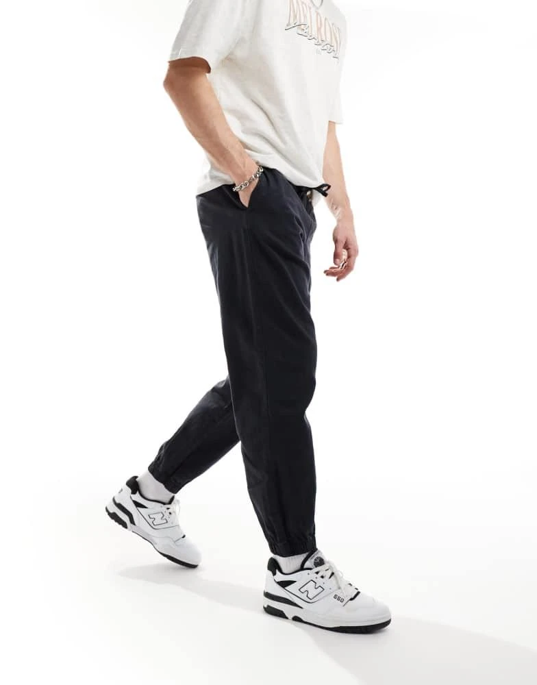 ASOS ASOS DESIGN tapered pull on linen trouser in washed navy 1