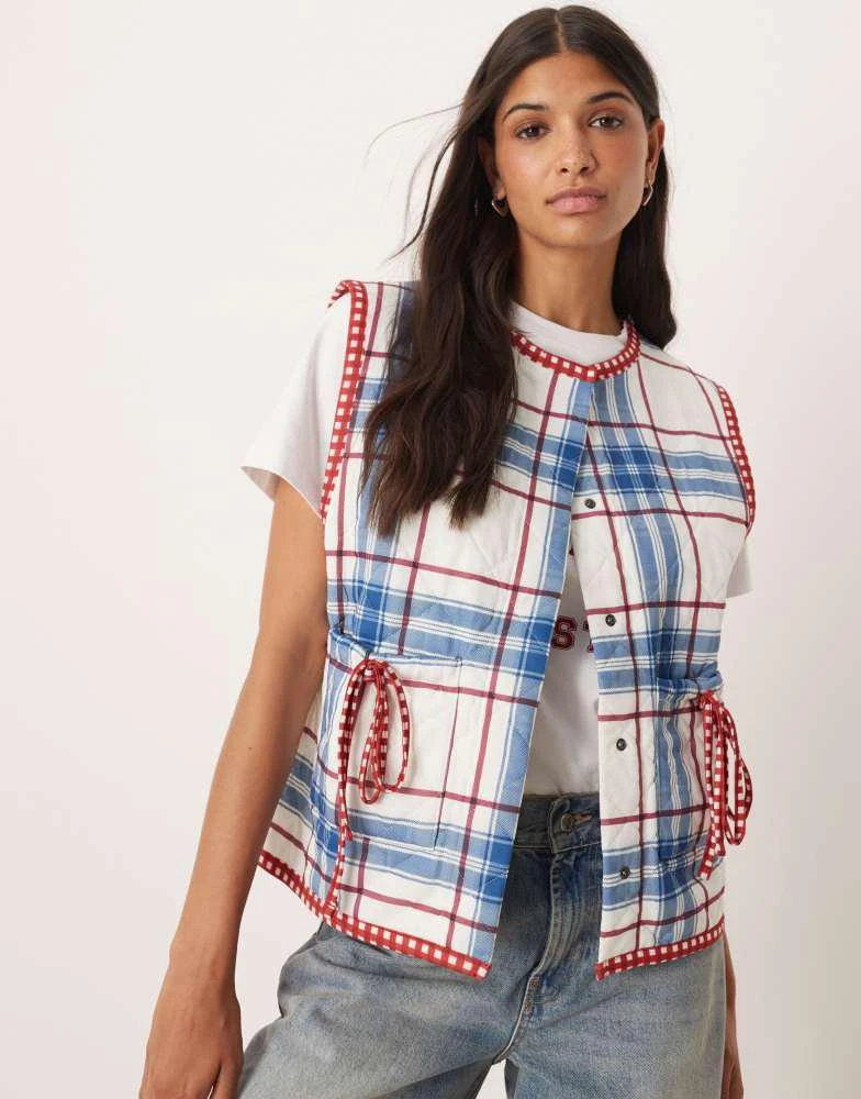 ASOS ASOS DESIGN gilet with check quilted design and bow pocket detail in blue 1