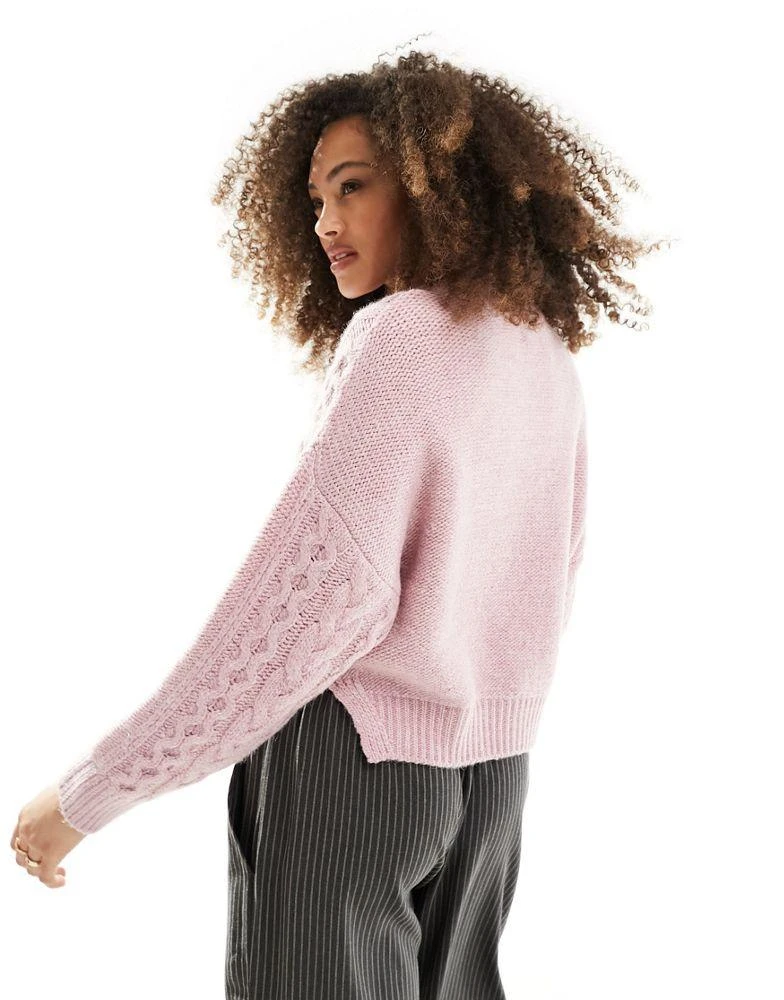 ASOS ASOS DESIGN crew neck cable jumper in pink 4