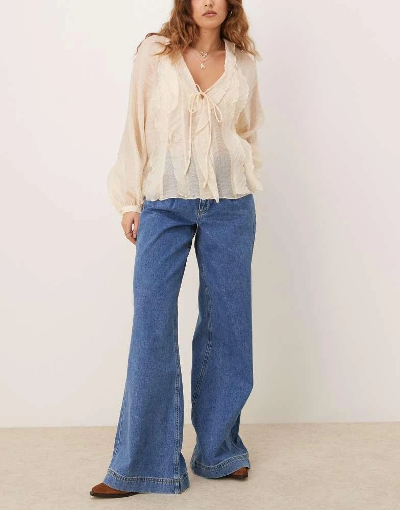 ASOS ASOS DESIGN pleated low rise jeans in mid blue 1