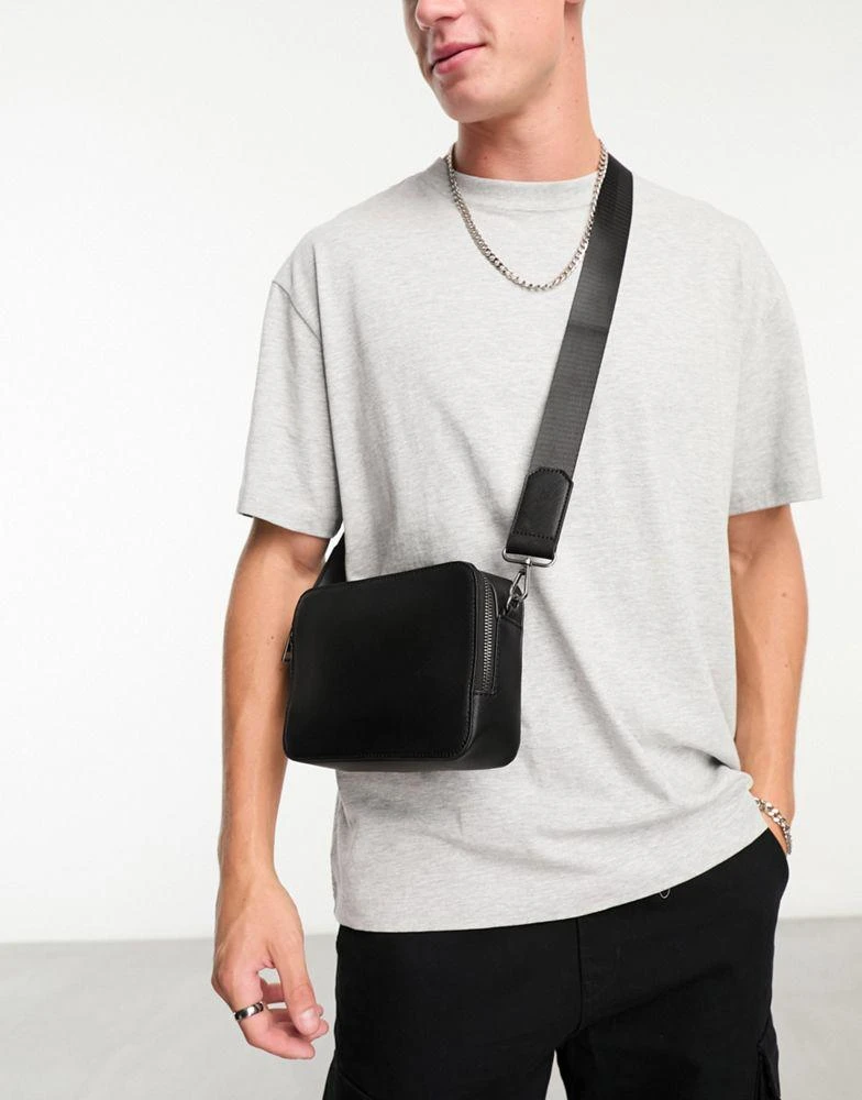ASOS ASOS DESIGN large faux leather cross body camera bag in black 1