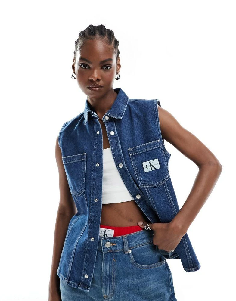 Calvin Klein Calvin Klein Jeans sleeveless lean denim shirt in mid wash 1