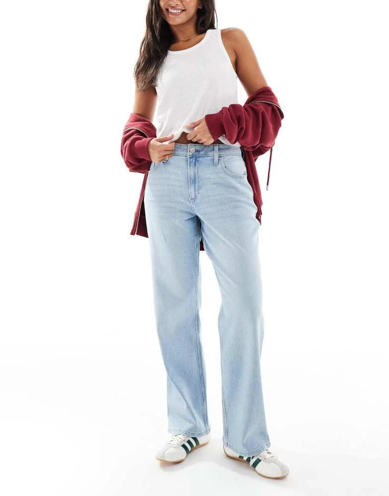 Shop Hollister high rise curvy dad jeans in medium blue wash on