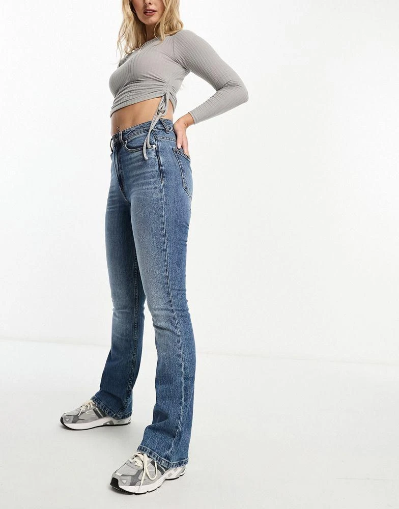 ASOS ASOS DESIGN Hourglass flared jeans in mid blue 3