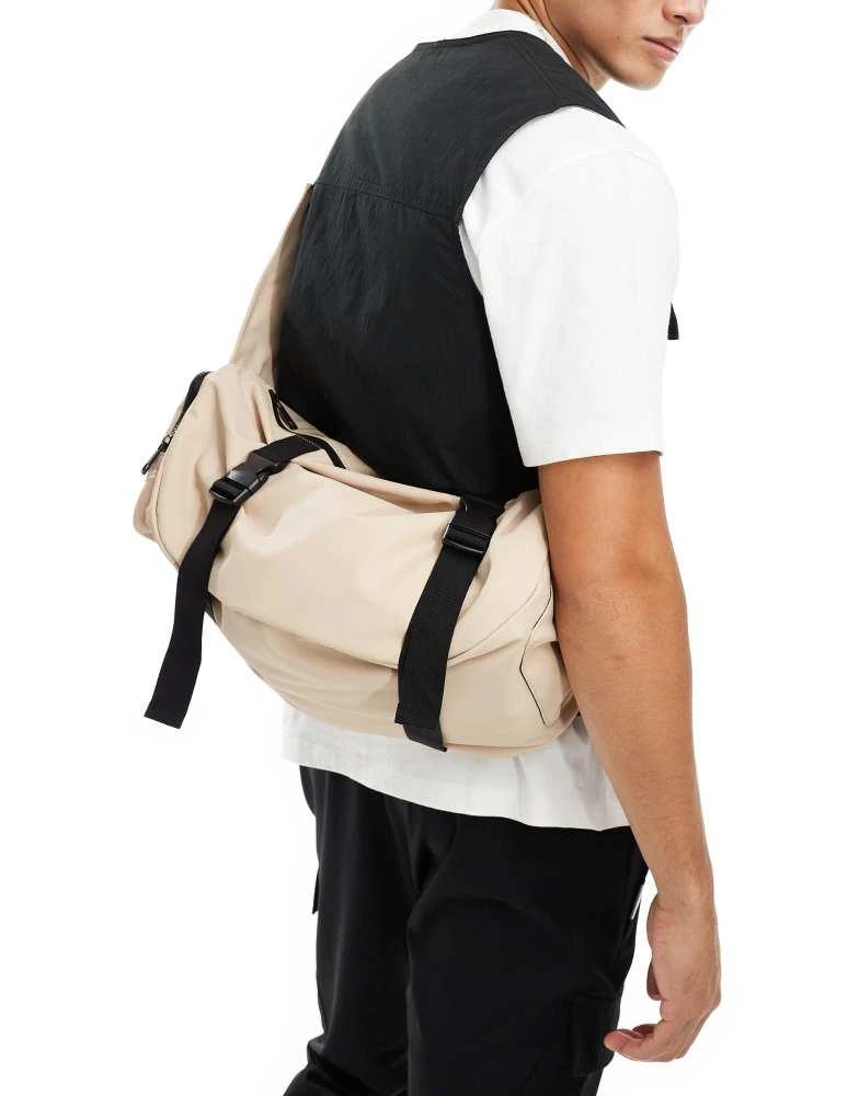 ASOS ASOS DESIGN rubberised cross body bag with pocket and buckle detail in beige 1