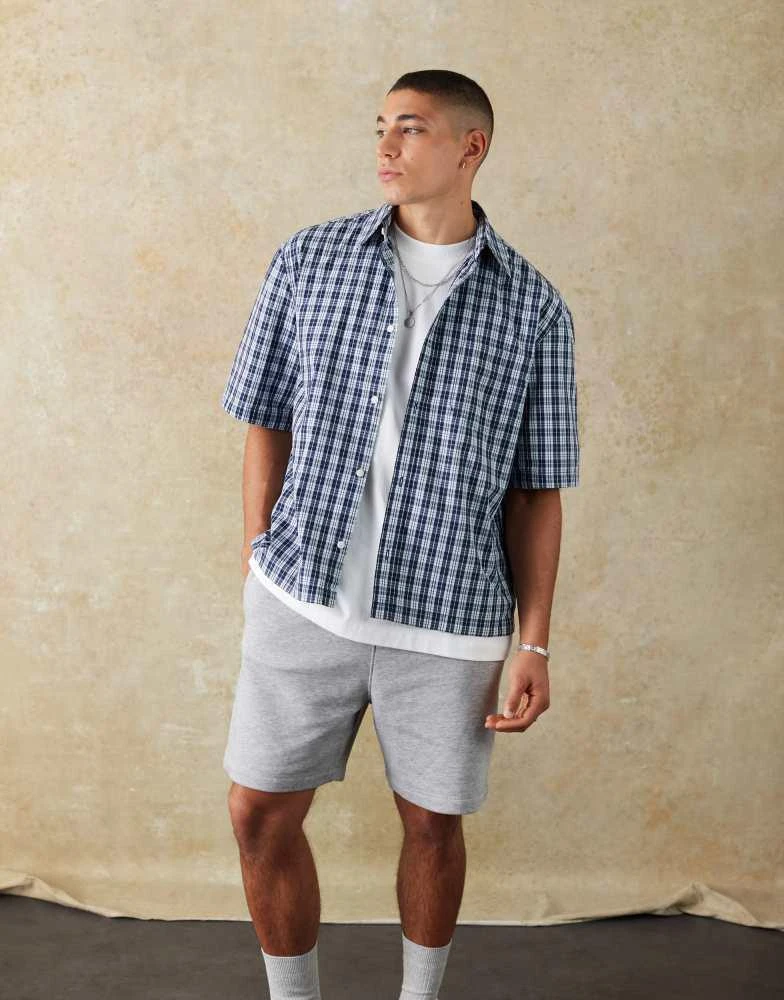 Weekday Weekday relaxed fit short sleeve shirt in navy check 1