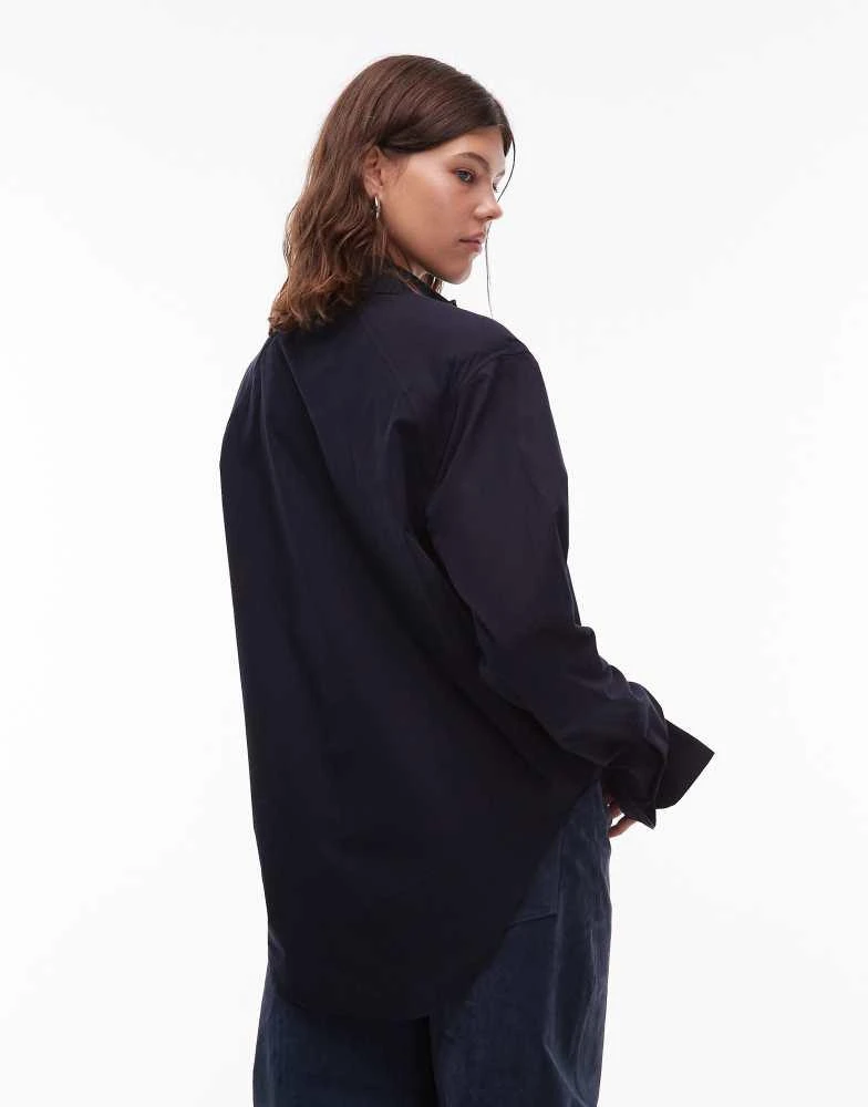 ASOS DESIGN dipped hem shoulder pad shirt in navy – On Sale Now