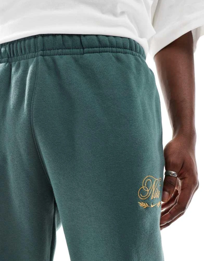 NIKE Nike Club festive joggers in dark green 3