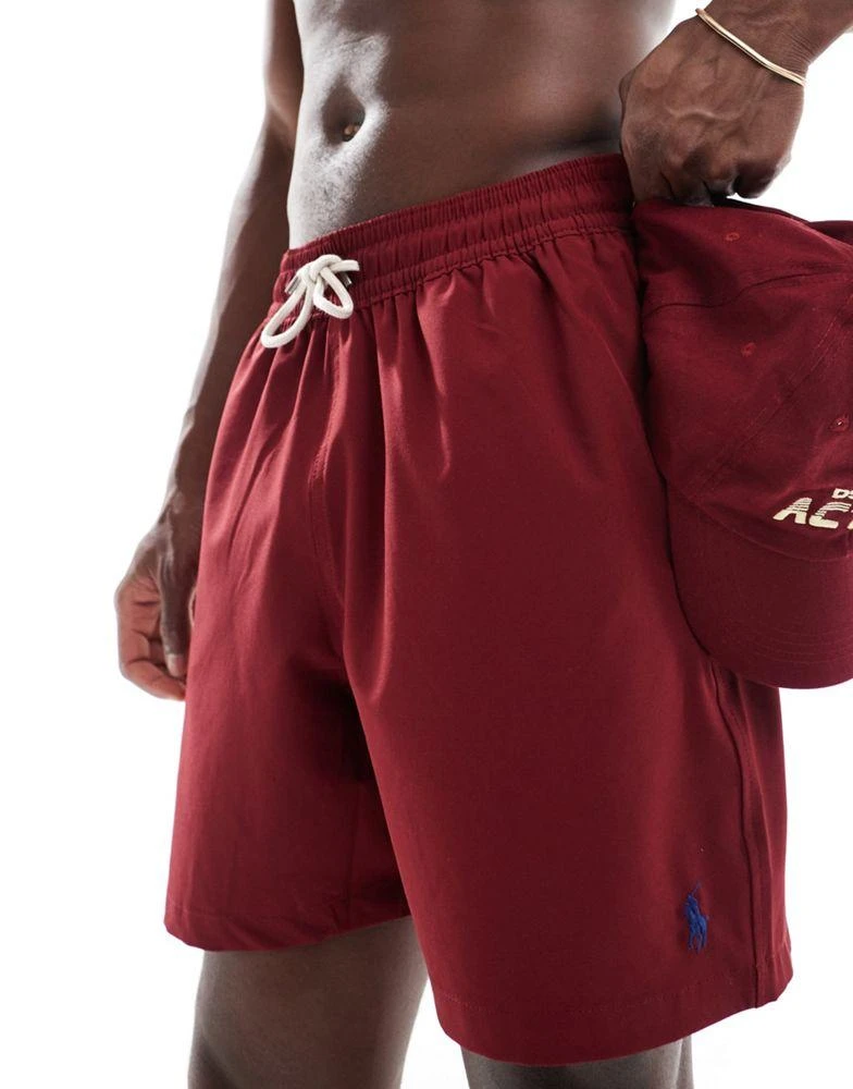 Shop Polo Ralph Lauren Traveler icon logo swim shorts in burgundy