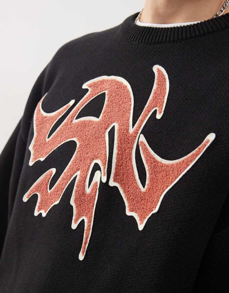 Weekday Weekday Cypher oversized jumper with red jacquard graphic in black