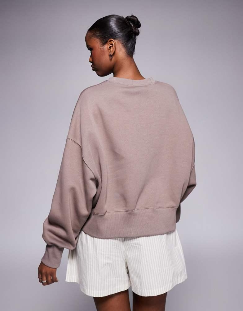 Shop Nike Phoenix Fleece over-oversized sweatshirt in brown