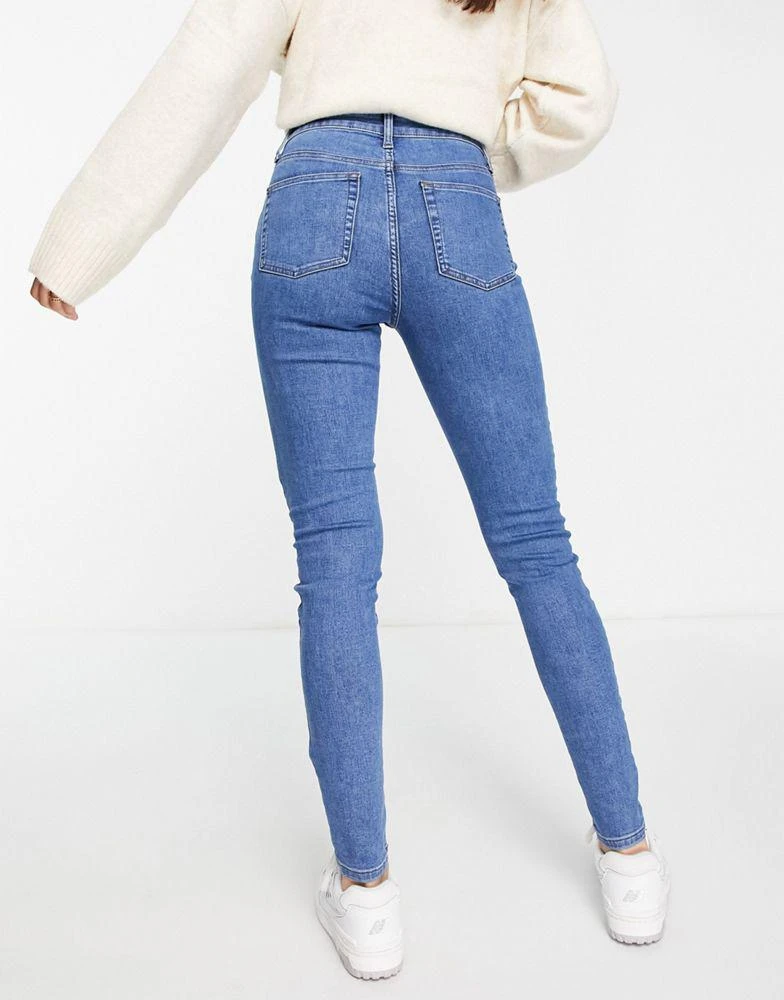 ASOS ASOS DESIGN skinny jeans in mid blue 2
