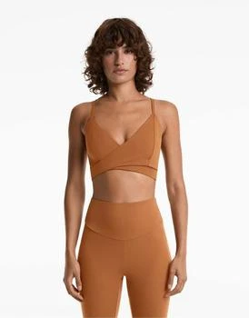 OYSHO Medium-support comfortlux crossover sports bra with cups in burnt orange