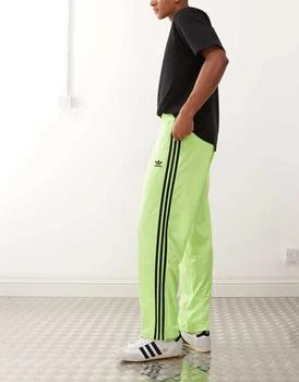 adidas Originals Firebird track pants in green and black